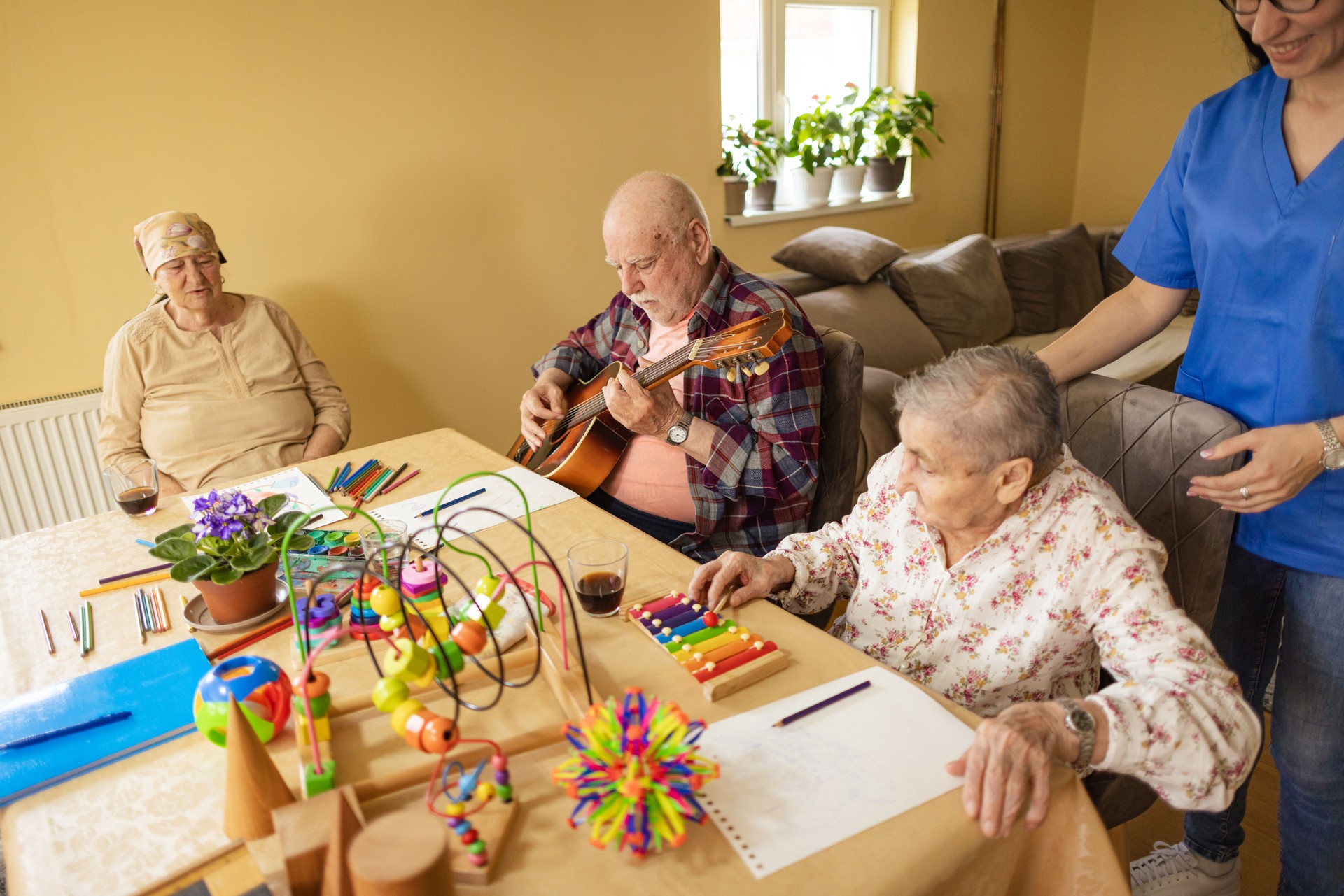 Elderly Man Playing Guitar at Nursing Home